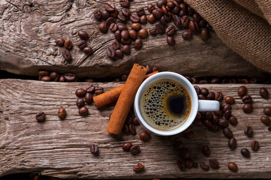 Cinnamon sticks and coffee cup
