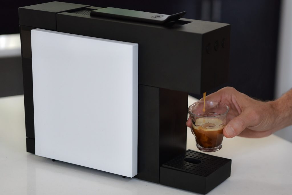 Making an expresso coffee in a pod coffee machine