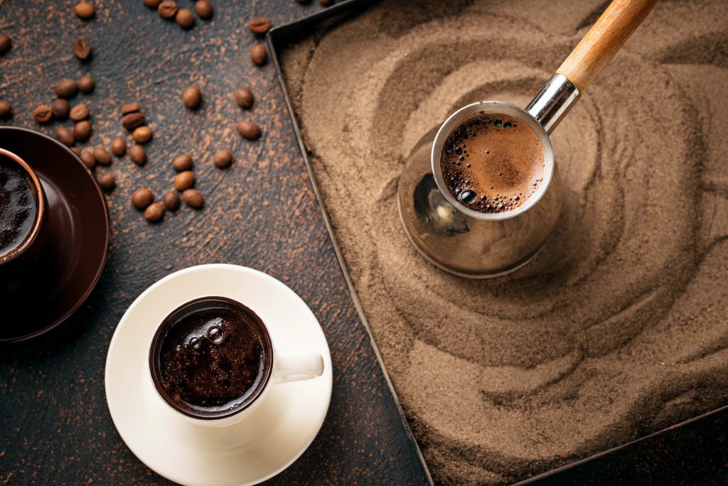 Traditional turkish coffee prepared on hot sand