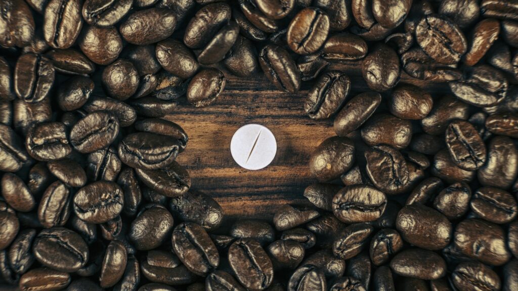 Caffeine Supplement Pill and Coffee Beans